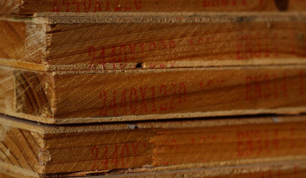 A stack of plywood sheets, showcasing the layered construction of this versatile panel. The image emphasizes the structural integrity and common use of plywood in various construction and woodworking projects.