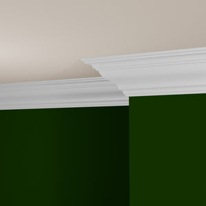 View of a room featuring the M4009F Primed White Pine Wood Crown Moulding installed, measuring 11/16 in x 7-1/4 in x 16 ft, highlighting an elegant and clean finish, ideal for enhancing the aesthetics of any space.