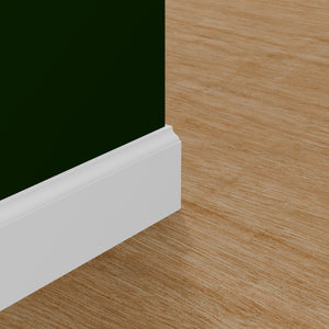 View of a room featuring the M0623X Primed White MDF Baseboard Moulding installed, measuring 1/2 in x 3-1/4 in x 16 ft, highlighting an elegant and clean finish, ideal for enhancing the aesthetics of any space.